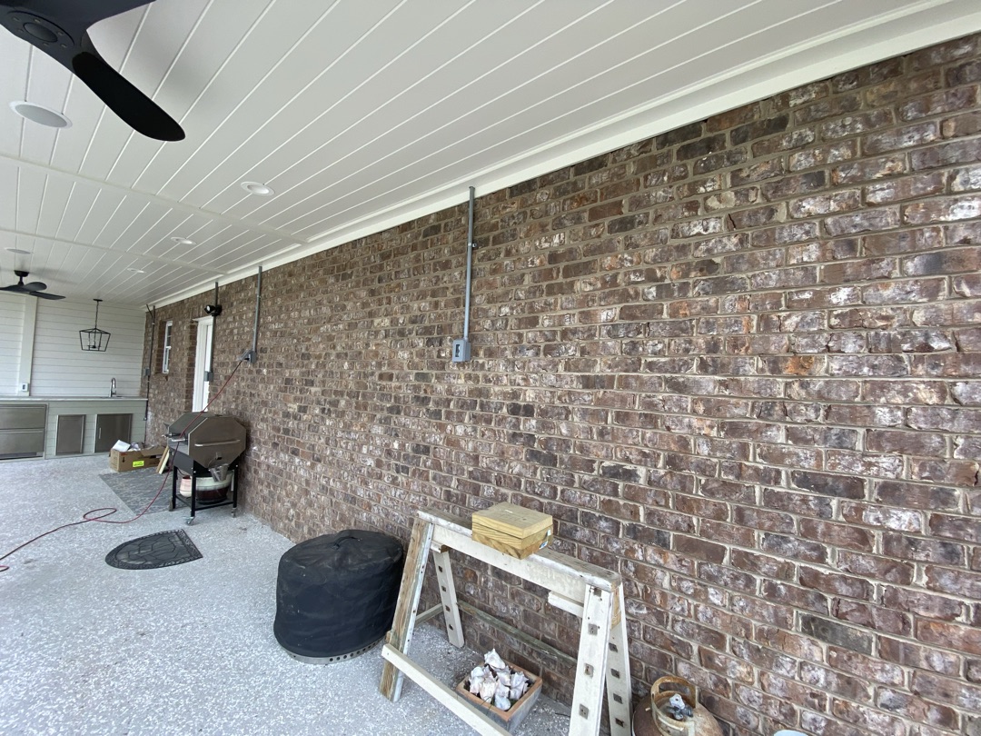 Unpainted brick patio before painting