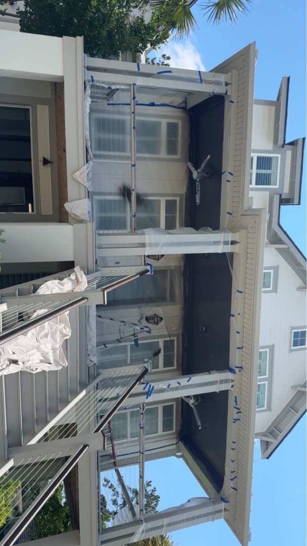 Exterior painting prep with masking and plastic