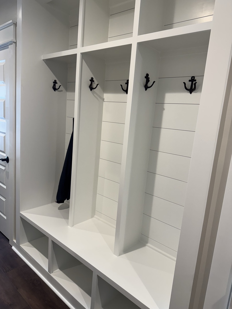 Custom painted mudroom cubbies with shiplap