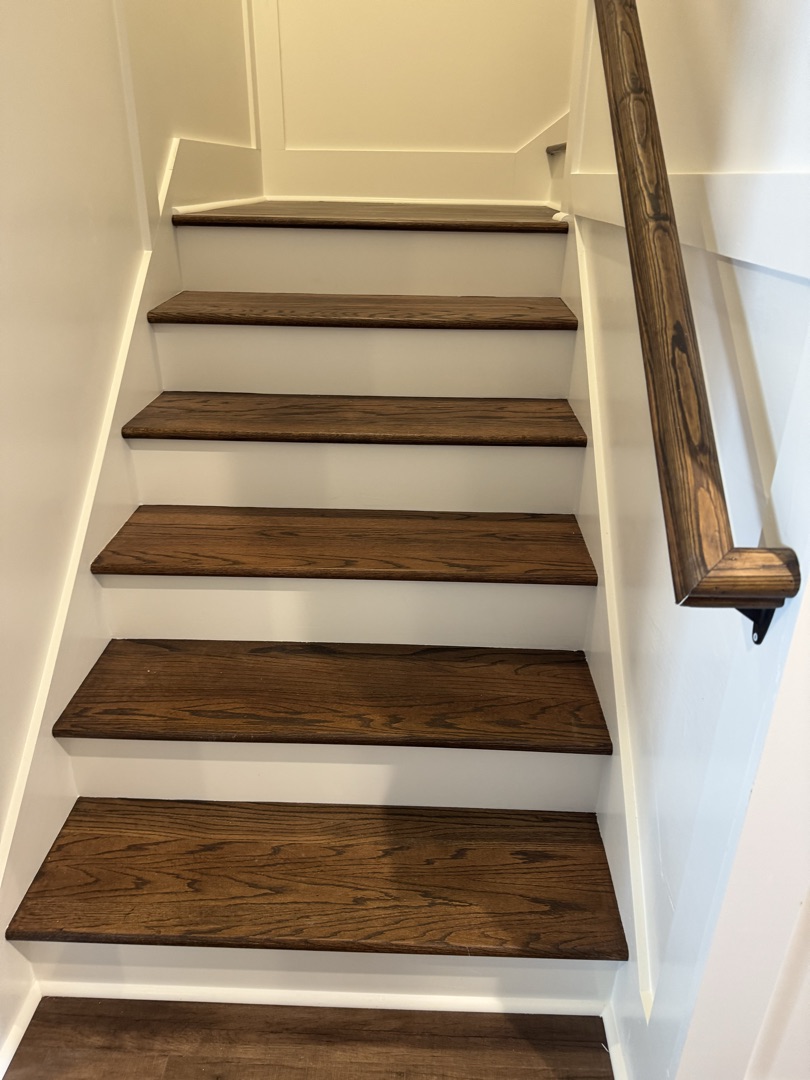 Stained oak stair treads with white risers